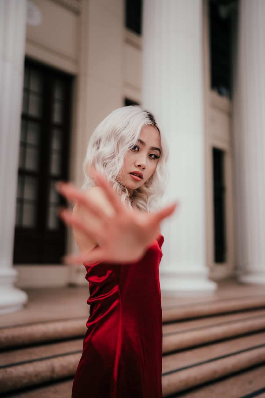 a woman in a red satin dress
